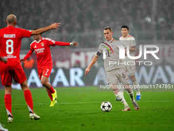 Joshua Kimmich of Bayern Munich  controls the ball during the Champions League Round 4 match between Bayern Munich v Benfica at the Allianz...