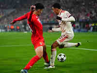 Jamal Musiala of Bayern Munich  controls the ball during the Champions League Round 4 match between Bayern Munich v Benfica at the Allianz a...