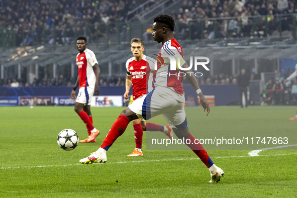 Bukayo Saka plays during the UEFA Champions League 2024/25 match between FC Internazionale and FC Arsenal at Stadio Giuseppe Meazza in Milan...