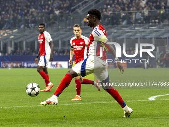 Bukayo Saka plays during the UEFA Champions League 2024/25 match between FC Internazionale and FC Arsenal at Stadio Giuseppe Meazza in Milan...