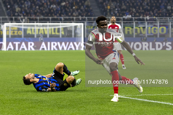 Bukayo Saka plays during the UEFA Champions League 2024/25 match between FC Internazionale and FC Arsenal at Stadio Giuseppe Meazza in Milan...