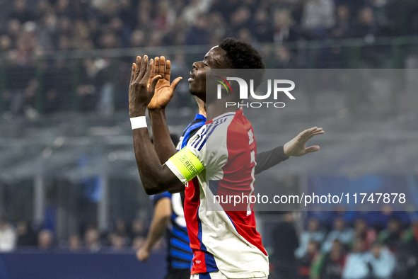 Bukayo Saka plays during the UEFA Champions League 2024/25 match between FC Internazionale and FC Arsenal at Stadio Giuseppe Meazza in Milan...