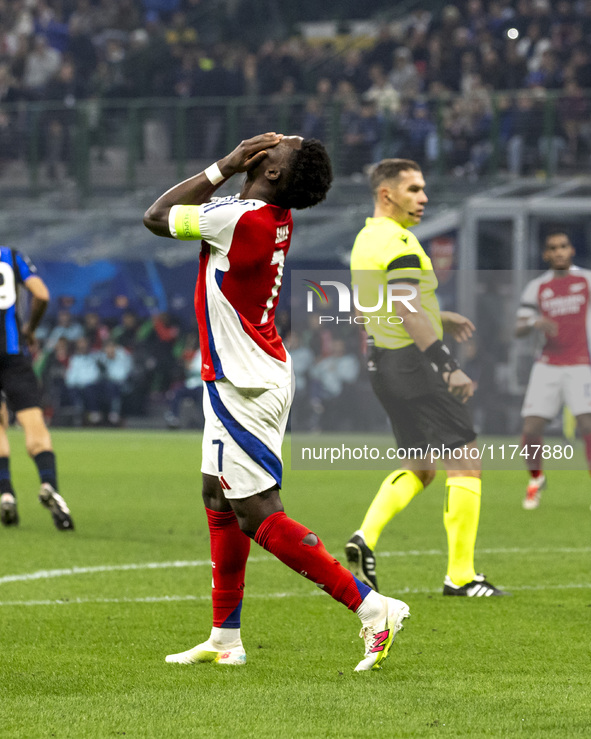 Bukayo Saka plays during the UEFA Champions League 2024/25 match between FC Internazionale and FC Arsenal at Stadio Giuseppe Meazza in Milan...