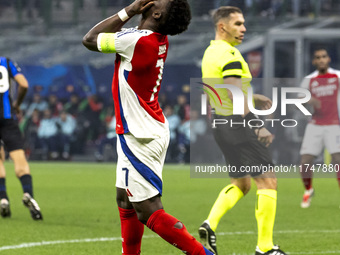 Bukayo Saka plays during the UEFA Champions League 2024/25 match between FC Internazionale and FC Arsenal at Stadio Giuseppe Meazza in Milan...