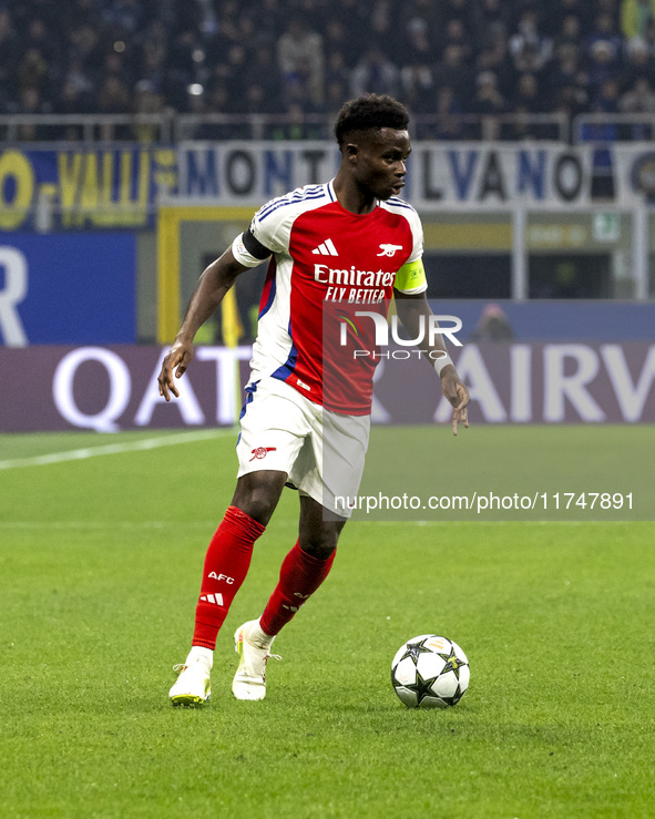 Bukayo Saka plays during the UEFA Champions League 2024/25 match between FC Internazionale and FC Arsenal at Stadio Giuseppe Meazza in Milan...