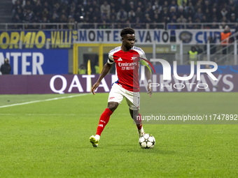 Bukayo Saka plays during the UEFA Champions League 2024/25 match between FC Internazionale and FC Arsenal at Stadio Giuseppe Meazza in Milan...