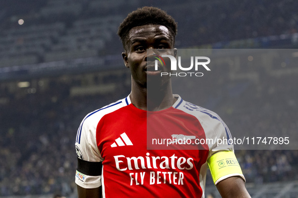 Bukayo Saka plays during the UEFA Champions League 2024/25 match between FC Internazionale and FC Arsenal at Stadio Giuseppe Meazza in Milan...