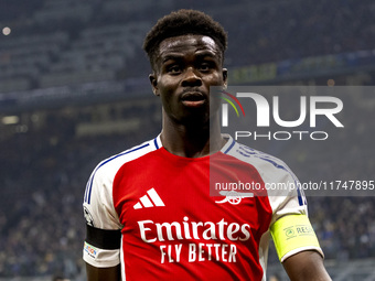 Bukayo Saka plays during the UEFA Champions League 2024/25 match between FC Internazionale and FC Arsenal at Stadio Giuseppe Meazza in Milan...