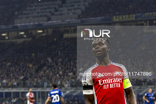 Bukayo Saka plays during the UEFA Champions League 2024/25 match between FC Internazionale and FC Arsenal at Stadio Giuseppe Meazza in Milan...