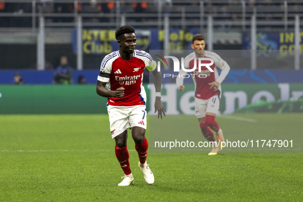 Bukayo Saka plays during the UEFA Champions League 2024/25 match between FC Internazionale and FC Arsenal at Stadio Giuseppe Meazza in Milan...