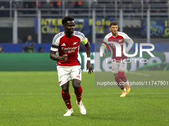 Bukayo Saka plays during the UEFA Champions League 2024/25 match between FC Internazionale and FC Arsenal at Stadio Giuseppe Meazza in Milan...