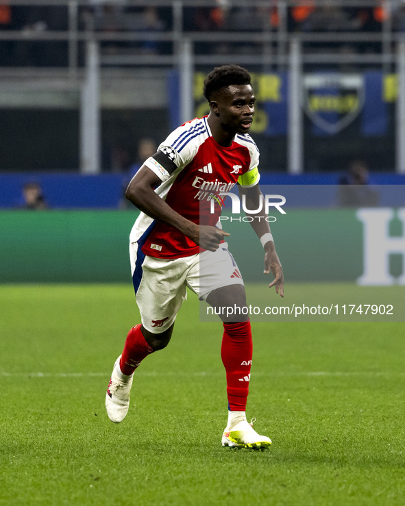 Bukayo Saka plays during the UEFA Champions League 2024/25 match between FC Internazionale and FC Arsenal at Stadio Giuseppe Meazza in Milan...