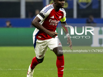 Bukayo Saka plays during the UEFA Champions League 2024/25 match between FC Internazionale and FC Arsenal at Stadio Giuseppe Meazza in Milan...