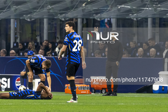 Benjamin Pavard and Mikel Arteta are in action during the UEFA Champions League 2024/25 match between FC Internazionale and FC Arsenal in Mi...