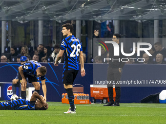 Benjamin Pavard and Mikel Arteta are in action during the UEFA Champions League 2024/25 match between FC Internazionale and FC Arsenal in Mi...