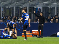 Benjamin Pavard and Mikel Arteta are in action during the UEFA Champions League 2024/25 match between FC Internazionale and FC Arsenal in Mi...