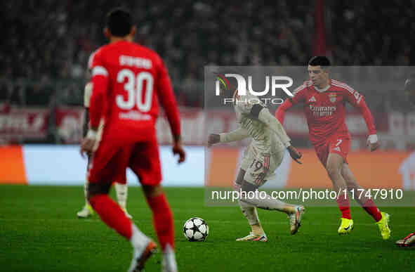 Alphonso Davies of Bayern Munich  controls the ball during the Champions League Round 4 match between Bayern Munich v Benfica at the Allianz...