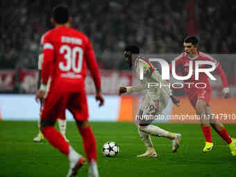 Alphonso Davies of Bayern Munich  controls the ball during the Champions League Round 4 match between Bayern Munich v Benfica at the Allianz...