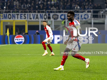 Bukayo Saka plays during the UEFA Champions League 2024/25 match between FC Internazionale and FC Arsenal at Stadio Giuseppe Meazza in Milan...