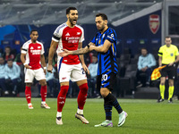 Lautaro Martinez and Mikel Merino are in action during the UEFA Champions League 2024/25 match between FC Internazionale and FC Arsenal in M...