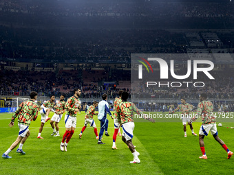 Arsenal warms up before the UEFA Champions League 2024/25 match between FC Internazionale and FC Arsenal at Stadio Giuseppe Meazza in Milano...