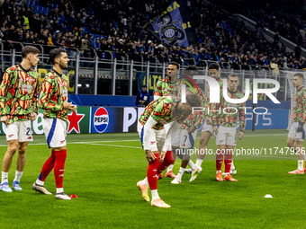 Arsenal warms up before the UEFA Champions League 2024/25 match between FC Internazionale and FC Arsenal at Stadio Giuseppe Meazza in Milano...