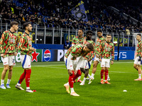 Arsenal warms up before the UEFA Champions League 2024/25 match between FC Internazionale and FC Arsenal at Stadio Giuseppe Meazza in Milano...