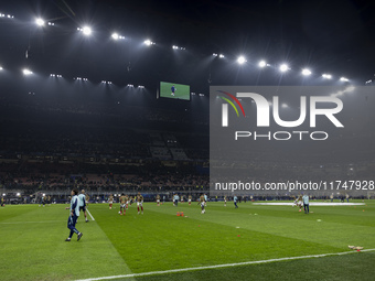 Arsenal warms up before the UEFA Champions League 2024/25 match between FC Internazionale and FC Arsenal at Stadio Giuseppe Meazza in Milano...