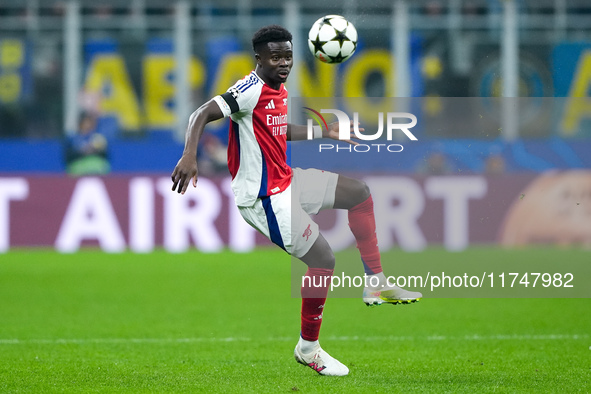 Bukayo Saka of Arsenal controls the ball during the UEFA Champions League 2024/25 League Phase MD4 match between FC Internazionale and Arsen...