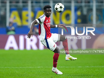 Bukayo Saka of Arsenal controls the ball during the UEFA Champions League 2024/25 League Phase MD4 match between FC Internazionale and Arsen...