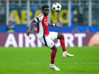 Bukayo Saka of Arsenal controls the ball during the UEFA Champions League 2024/25 League Phase MD4 match between FC Internazionale and Arsen...