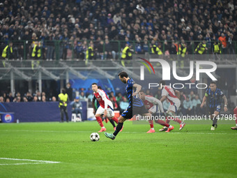 Hakan Calhanoglu of FC Internazionale scores a penalty during the UEFA Champions League stage match Phase MD4 between Inter FC Internazional...