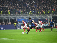 Hakan Calhanoglu of FC Internazionale scores a penalty during the UEFA Champions League stage match Phase MD4 between Inter FC Internazional...