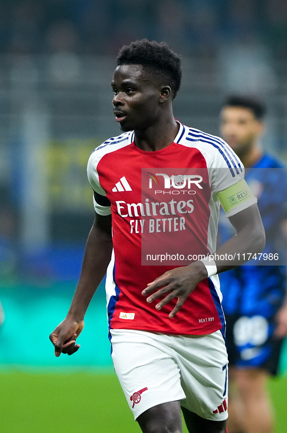 Bukayo Saka of Arsenal looks on during the UEFA Champions League 2024/25 League Phase MD4 match between FC Internazionale and Arsenal at Sta...