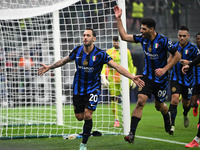 Marcus Thuram of FC Inter celebrates after a penalty during the UEFA Champions League stage match Phase MD4 between Inter FC Internazionale...