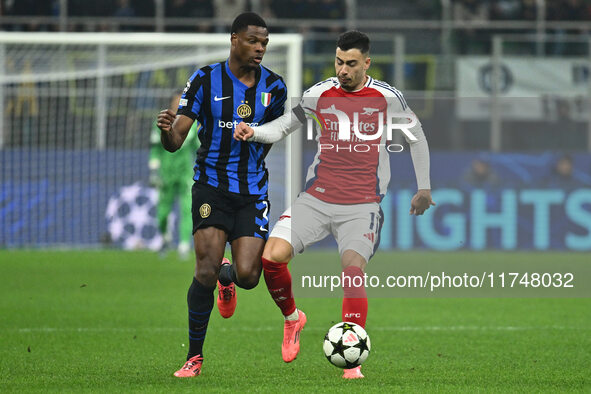 Denzel Dumfries of F.C. Inter and Gabriel Martinelli of Arsenal F.C. are in action during the UEFA Champions League 2024/25 League Phase MD4...