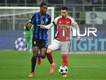 Denzel Dumfries of F.C. Inter and Gabriel Martinelli of Arsenal F.C. are in action during the UEFA Champions League 2024/25 League Phase MD4...