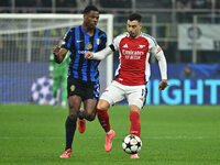 Denzel Dumfries of F.C. Inter and Gabriel Martinelli of Arsenal F.C. are in action during the UEFA Champions League 2024/25 League Phase MD4...