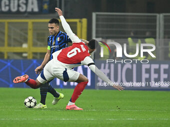 Lautaro Martinez of F.C. Inter and Gabriel of Arsenal F.C. are in action during the UEFA Champions League 2024/25 League Phase MD4 match bet...