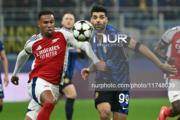 Gabriel of Arsenal F.C. and Mehdi Taremi of F.C. Inter are in action during the UEFA Champions League 2024/25 League Phase MD4 match between...