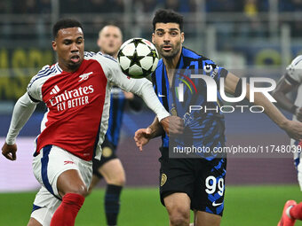 Gabriel of Arsenal F.C. and Mehdi Taremi of F.C. Inter are in action during the UEFA Champions League 2024/25 League Phase MD4 match between...