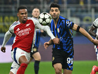 Gabriel of Arsenal F.C. and Mehdi Taremi of F.C. Inter are in action during the UEFA Champions League 2024/25 League Phase MD4 match between...