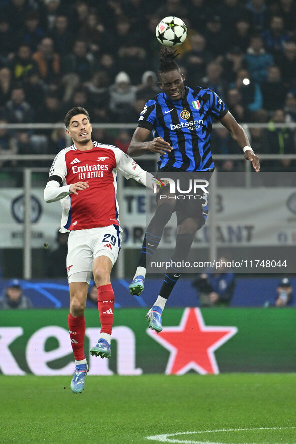 Kai Havertz of Arsenal F.C. and Yann Aurel Bisseck of F.C. Inter are in action during the UEFA Champions League 2024/25 League Phase MD4 mat...