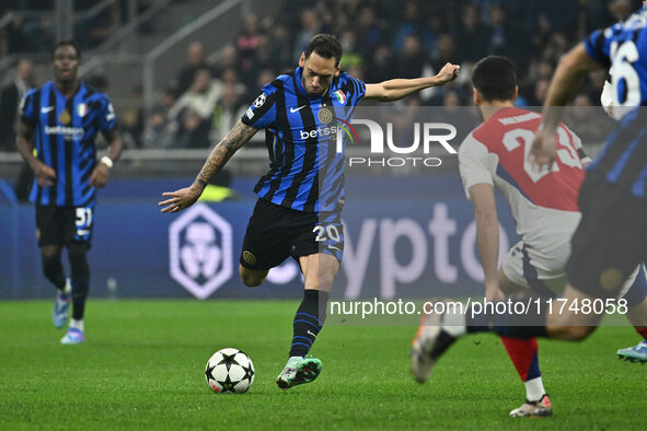 Hakan Calhanoglu of F.C. Inter is in action during the UEFA Champions League 2024/25 League Phase MD4 match between F.C. Inter and Arsenal F...