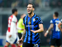 Hakan Calhanoglu of FC Internazionale yells during the UEFA Champions League 2024/25 League Phase MD4 match between FC Internazionale and Ar...