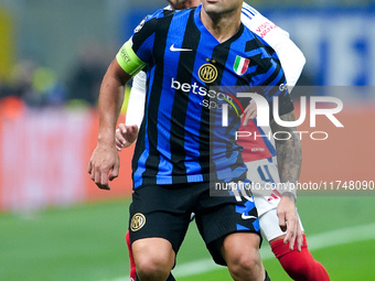 Lautaro Martinez of FC Internazionale and Ben White of Arsenal compete for the ball during the UEFA Champions League 2024/25 League Phase MD...