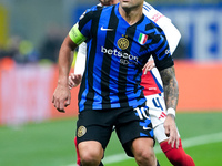 Lautaro Martinez of FC Internazionale and Ben White of Arsenal compete for the ball during the UEFA Champions League 2024/25 League Phase MD...