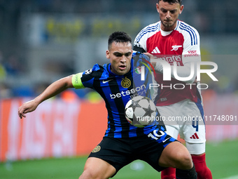 Lautaro Martinez of FC Internazionale and Ben White of Arsenal compete for the ball during the UEFA Champions League 2024/25 League Phase MD...