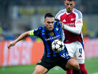 Lautaro Martinez of FC Internazionale and Ben White of Arsenal compete for the ball during the UEFA Champions League 2024/25 League Phase MD...