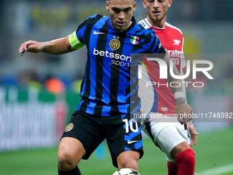 Lautaro Martinez of FC Internazionale and Ben White of Arsenal compete for the ball during the UEFA Champions League 2024/25 League Phase MD...